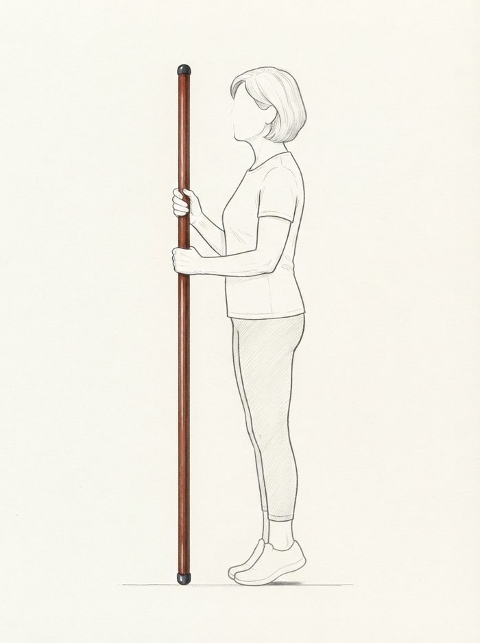 Heel raises holding the pole for balance